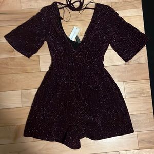XXS Purple sparkly romper from Francesca’s. Super cute, never wore.